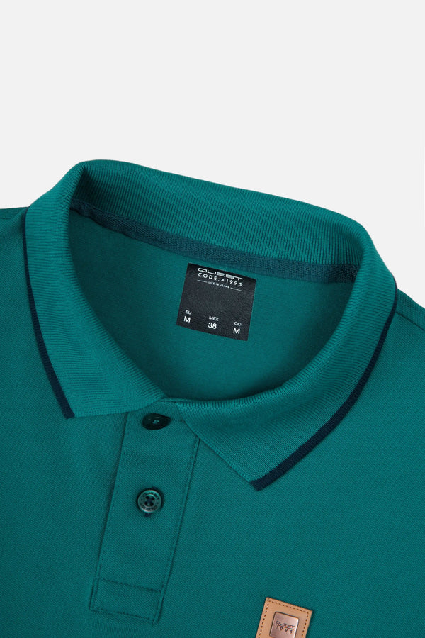 POLO TIPPING COLOR VERDE TORMENTA-AZUL NOCHE
