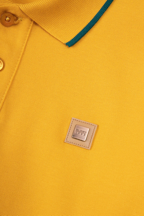 POLO TIPPING COLOR MOSTAZA - VERDE TORMENTA