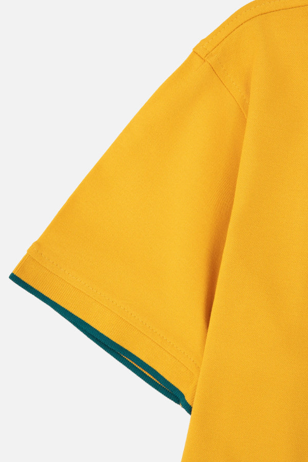 POLO TIPPING COLOR MOSTAZA - VERDE TORMENTA